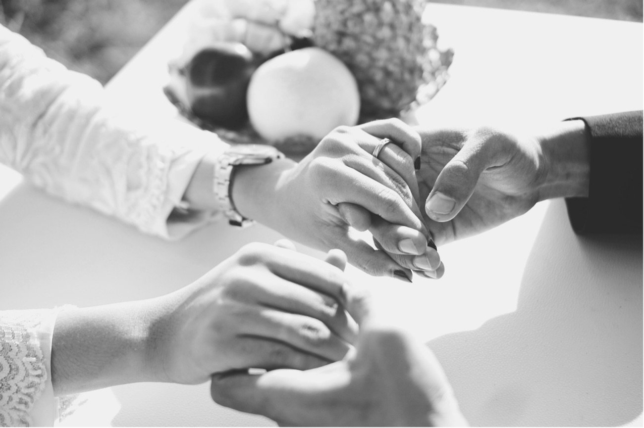 Hands joined during a relationship conversation
